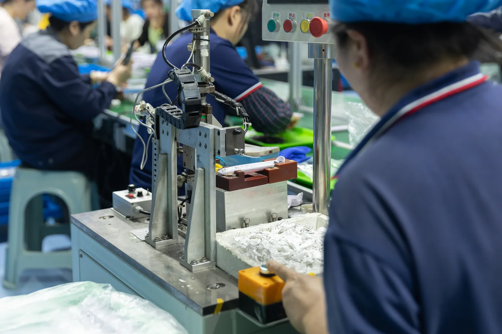 Production workstation with technicians and equipment